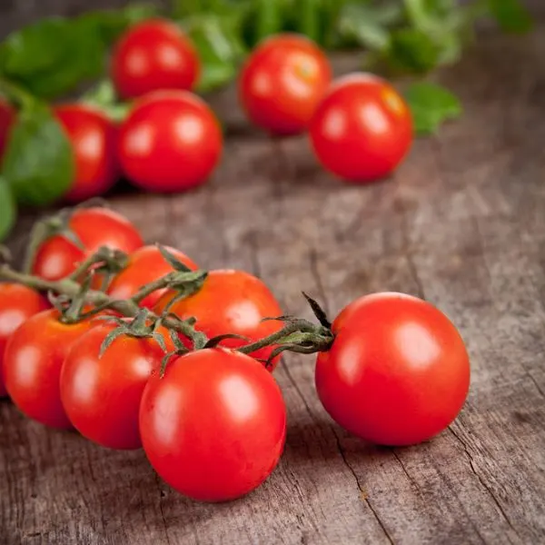 Cherry-tomatoes-on-wooden-tablelow-depth-photo