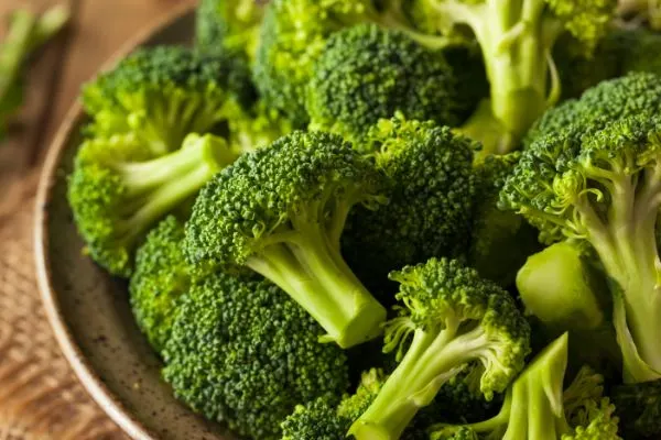 Broccoli in a wooden bowl.