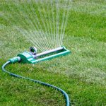 Oscillating Sprinkler watering lawn